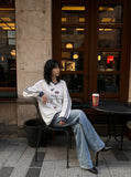 DAXUEN white v-neck heart motif long-sleeve top — model photo