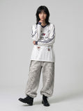 DAXUEN white v-neck heart motif long-sleeve top — model photo