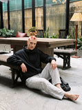 DAXUEN black and white checkered wide-leg pants — model photo
