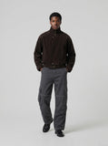 DAXUEN Wide-leg cargo pants with pockets and frayed seams — model photo