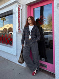 DAXUEN Wide-leg cargo pants with pockets and frayed seams — model photo