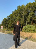 DAXUEN Wide-leg loose-fit cargo pants in dark grey and black — model photo