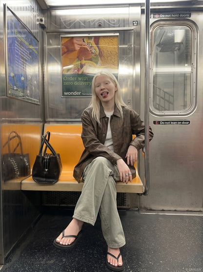 DAXUEN black wide-leg cargo pants with angled stitching — model photo