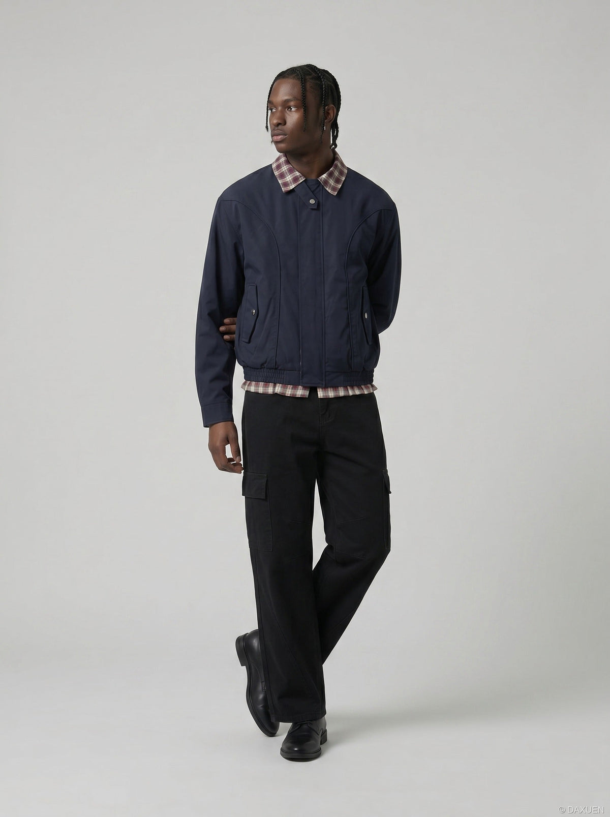 DAXUEN black wide-leg cargo pants with angled stitching — model photo