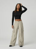 DAXUEN Wide-leg cargo pants in light beige/khaki color — model photo