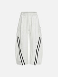 Heather grey wide-leg cargo track pants featuring black curved stripes on the lower legs and an elasticated drawstring waistband.