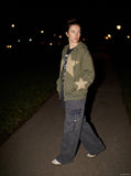 DAXUEN dark grey wide-leg cargo pants with woven strap detail — model photo