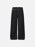 Dark wash wide-leg streetwear jeans with contrast stitching, gold-tone hardware, and script letter embroidery on the back pockets.
