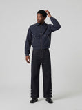 DAXUEN Wide-leg denim pants with slits and contrasting stitching — model photo