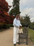 DAXUEN Wide-leg denim trousers in dark indigo, white, and black — model photo