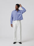 DAXUEN Wide-leg denim trousers in dark indigo, white, and black — model photo