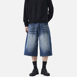 DAXUEN Pair of wide-leg distressed denim shorts