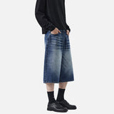 DAXUEN Pair of wide-leg distressed denim shorts