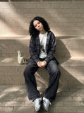 DAXUEN Wide-leg distressed denim trousers — model photo
