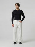 DAXUEN High-waisted wide-leg pants in solid black and white — model photo