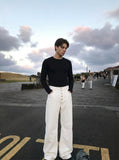 DAXUEN High-waisted wide-leg pants in solid black and white — model photo