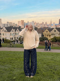 DAXUEN dark wash indigo denim jeans with button detail — model photo