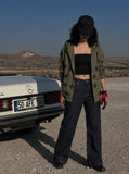 DAXUEN Wide-leg indigo jeans with contrast stitching and embroidery — model photo