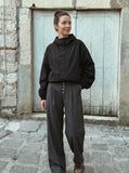 DAXUEN Wide-leg pinstripe trousers in dark charcoal grey — model photo