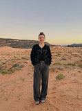 DAXUEN Wide-leg pinstripe trousers in dark charcoal grey — model photo