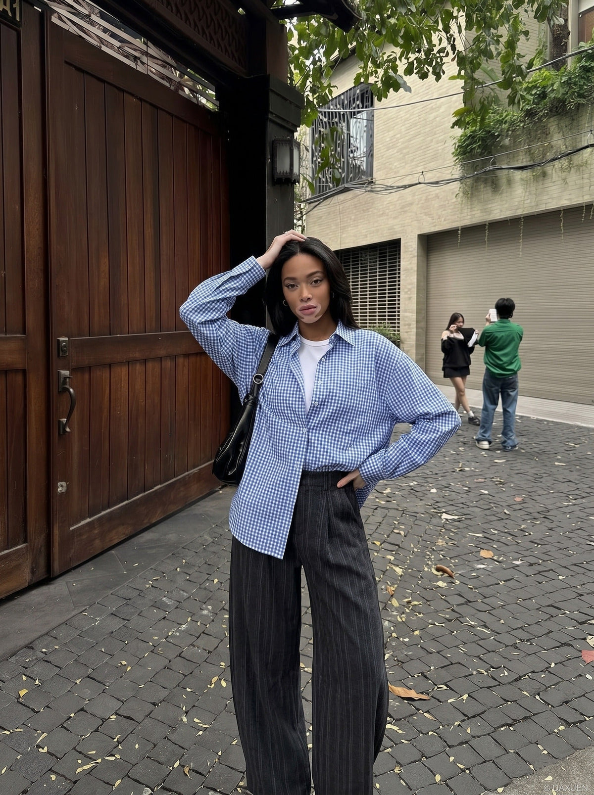 DAXUEN Wide-leg pinstripe trousers in dark grey — model photo