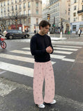DAXUEN Wide-leg snowflake pattern casual pants — model photo