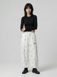 DAXUEN Wide-leg snowflake pattern casual pants — model photo