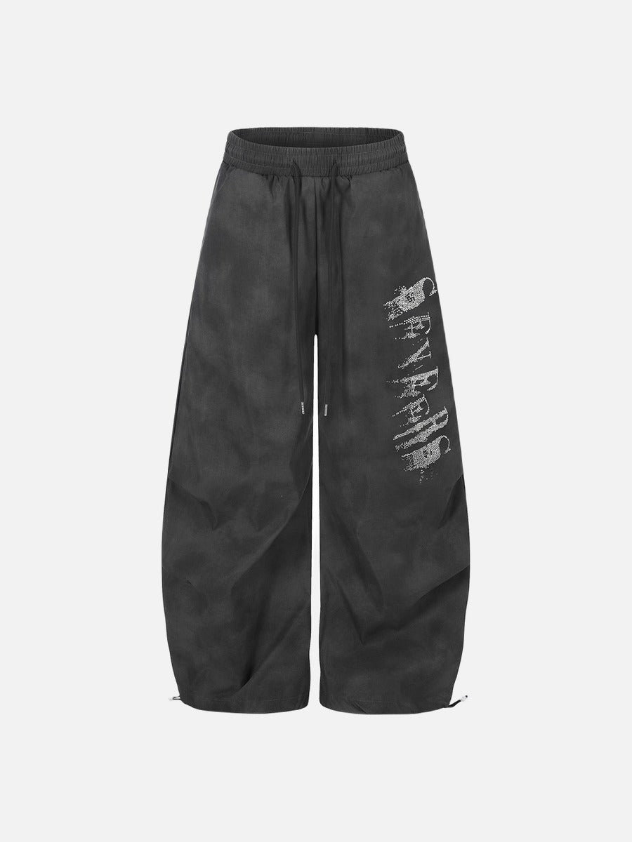 DAXUEN Wide-leg pants with studded graphic design