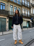 DAXUEN Wide-leg pants with studded graphic design — model photo