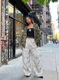 DAXUEN Wide-leg pants with studded graphic design — model photo