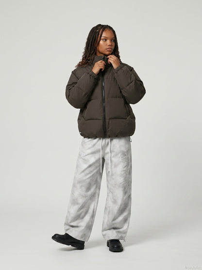 DAXUEN Wide-leg pants with studded graphic design — model photo