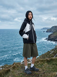 DAXUEN Men's wide-leg summer shorts in dark olive green and black — model photo