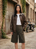 DAXUEN Men's wide-leg summer shorts in dark olive green and black — model photo