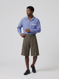 DAXUEN Men's wide-leg summer shorts in dark olive green and black — model photo