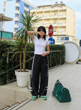DAXUEN Wide-leg track pants in solid colors — model photo
