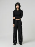 DAXUEN Wide-leg track pants in solid colors — model photo