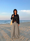 DAXUEN Wide-leg trousers in light khaki color — model photo