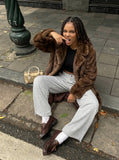 DAXUEN Wide-leg trousers with pleated design and adjustable hem — model photo