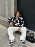 DAXUEN white wide-leg denim trousers with contrast stitching — model photo