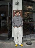 DAXUEN white wide-leg denim trousers with contrast stitching — model photo