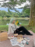 DAXUEN black textured knit top with winged and cloaked graphics — model photo