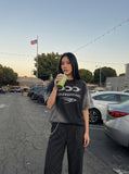 DAXUEN Oversized crew neck t-shirt with wing graphics — model photo