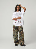DAXUEN Oversized Cartoon Dogs Graphic Tee — model photo
