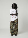 DAXUEN Oversized Cartoon Dogs Graphic Tee — model photo