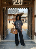 DAXUEN Oversized Cartoon Dogs Graphic Tee — model photo