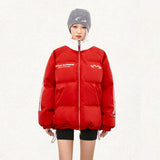 Model wearing the red Oversized Loose Padded Puffer Jacket in a gray background 