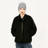 Model wearing the black Y2k Loose Padded Jacket in a gray background 