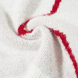 Details of white Shuriken Stars Loose Sweater showing the texture of the fabric