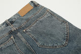 Distressed Button-Fly Denim Jeans
