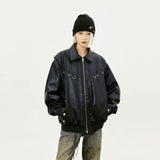 Model wearing the black Oversized Loose PU Leather Jacket in a gray background
